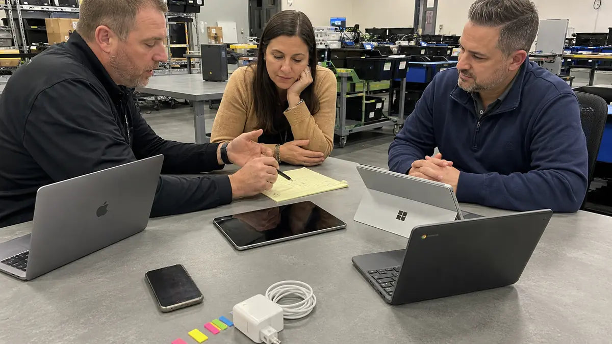 CTI team consulting with a client about a device program